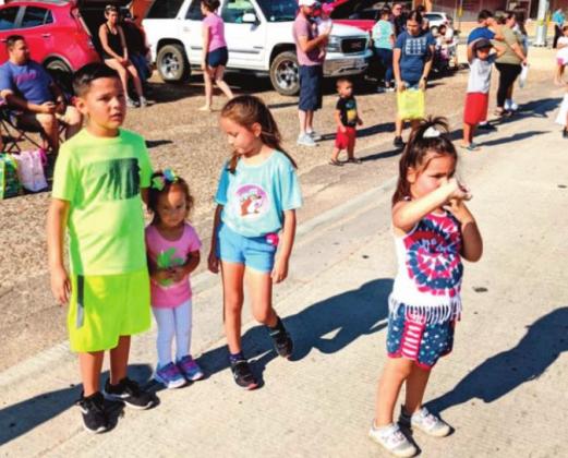 (right) Both kids and adults gathered to enjoy the parade.