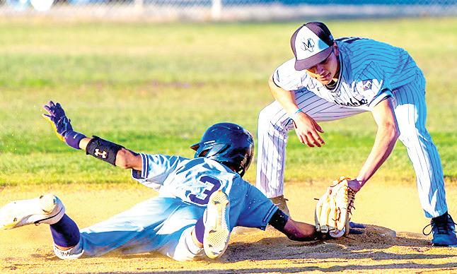 Bobcats Jadrian Herrera slides into base in the game against the Mules.