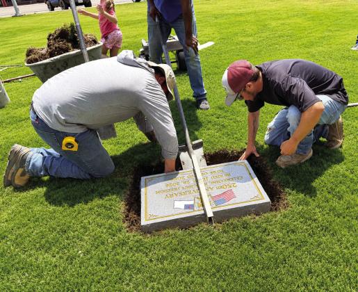 Far left: Pastors Lupe Acevedo, Nathan Adams and Ted Taylor representing the Hereford Ministerial Alliance buried the 250th Celebration of Religious Freedom Time Capsule at the Courthouse. Left, items in the time capsule are displayed. Above, left, the capsule is buried and also pictured are four Hereford youngsters. When the capsule is opened in 50 years Lana Lujan will be 56, Amarah Lujan will be 57, Ezra Taylor will be 59 and Eli Martinez will be 52. (Courtesy photos)