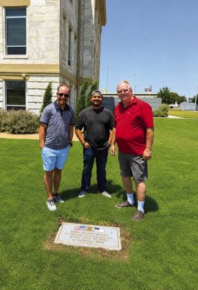 Far left: Pastors Lupe Acevedo, Nathan Adams and Ted Taylor representing the Hereford Ministerial Alliance buried the 250th Celebration of Religious Freedom Time Capsule at the Courthouse. Left, items in the time capsule are displayed. Above, left, the capsule is buried and also pictured are four Hereford youngsters. When the capsule is opened in 50 years Lana Lujan will be 56, Amarah Lujan will be 57, Ezra Taylor will be 59 and Eli Martinez will be 52. (Courtesy photos)