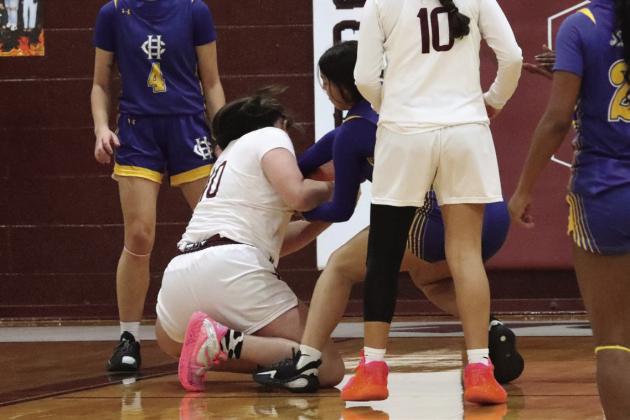 Bailey Acker fights for possession of the ball