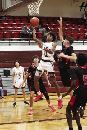 CJ Parker takes the ball to the basker