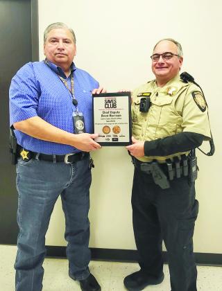 Castro County Sheriff Sal Rivera (left) pictured with Castro County Chief Deputy Brent Harrison. Harrison was recognized recently at a firearms show in Las Vegas, Nev.