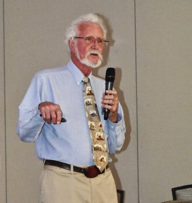 DIRT DIGGER--Joe D. Rogers, Registered Professional Archaeologist and well-remembered former teacher of History at Hereford High School, spins tales of dig adventures to members of the Texas Association of Healthcare Volunteers during their district meeting in Hereford on September 18 at the Hereford Civic Center. (Photo by Jim Steiert)