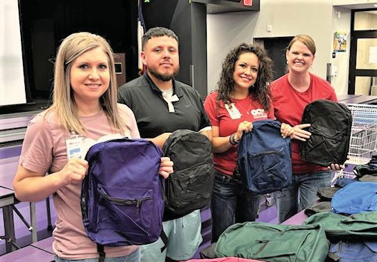 DISD School Supply Drive - Laura Case-CCH CFO, Gabriel Montiel, In a Jam Organization, Angelica Montiel, CCH Pharmacy, and Elisha Rosier-CCH CEO.