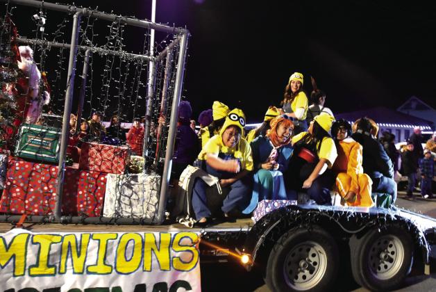 MINIONS ON CREDIT—Pranksters from the Hereford Texas Federal Credit Union have fun tossing goodies to the parade crowd. (Photo by Jim Steiert)