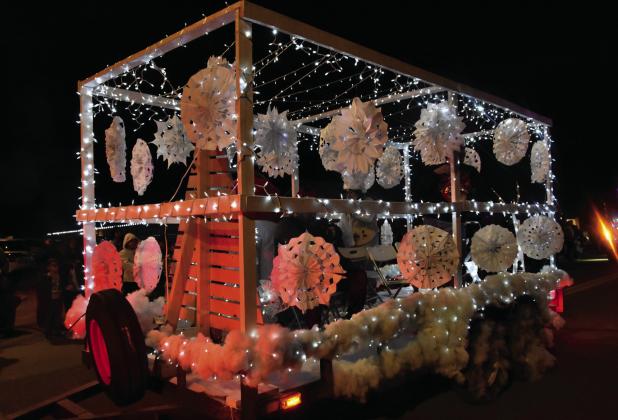 A ZILLION SHAPES—This Christmas Parade float was a study in snowflake shapes. (Photo by Jim Steiert)