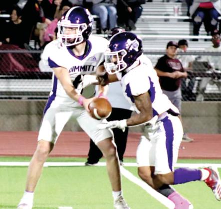 Bobcats QB Jack Lunsford hands off to Dallas Starkey during the Tulia game. (Dimmitt Sports Media photo)