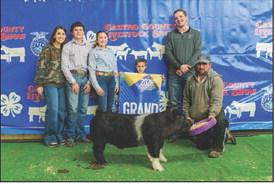 page 4 - January 30, 2025 Colow Farris and the Grand Champion Barrow at the Nazareth Stock Show.