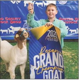 Reed Scholz and the Reserve Grand Champion Goat.