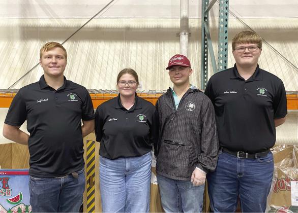 ”Hands to larger service” ... Oldham and Deaf Smith 4-H clubs teamed up to help sort food at the High Plains Food Bank Wednesday night. Pictured at left (from left) are Deaf Smith County 4-H members Josef Grotegut, Lillian Baird, Johan Grotegut and Andrew Matthews. (Courtesy photos)