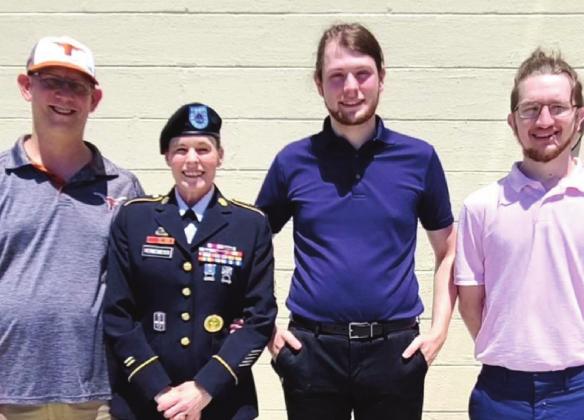 Master Sergeant Hermesmeyer with family, including her husband Michael Hermesmeyer and son Robert.