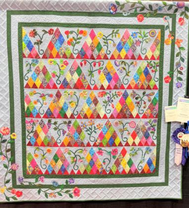 The Ogallala Quilt Festival Viewer’s Choice winner Pyramid Bouquets by Ann Powell.