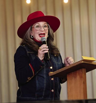Deaf Smith County Chamber of Commerce Director Junie Wagner welcomes the crowd to the annual banquet. (Photos Courtesy of Pam McNutt)
