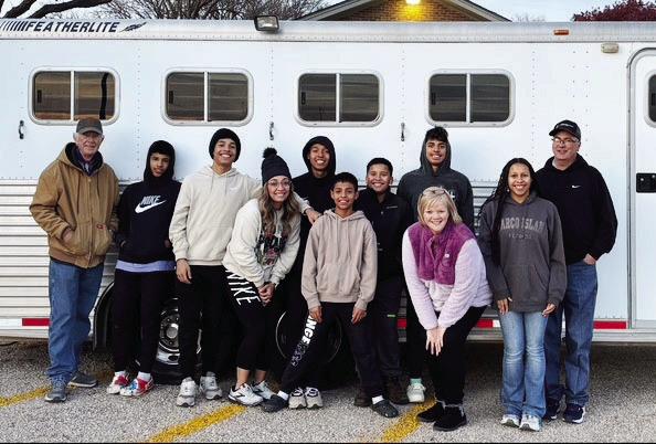 The Cantrell Family with volunteers from Dimmitt loading a trailer for delivery.