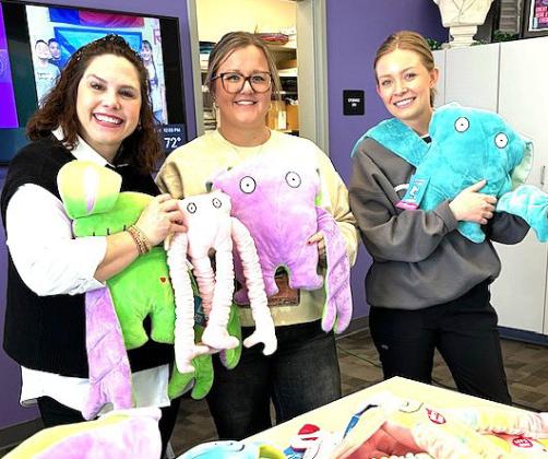 Castro County Healthcare donated Bumpas weighted stuffed animals and sensory toys to the students of Richardson Elementary School. The Bumpas plush toy is made of soft material, with a unique design that allows its arms to wrap around you in a heart-shaped hug when held against your chest. The toys will be used by the special education teacher at Richardson Elementary. Shown are Jennifer Sullivan, RES Principal, Callen Edwards, Instructional Coach, and Braydin Goodwin, DISD Nurse.