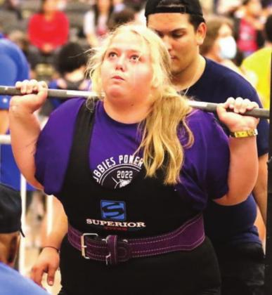 (Photo left) DHS sophomore Allysun Jones competing in squat at the THSWPA state meet where she came in with her personal best.