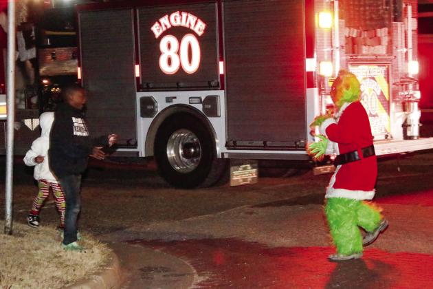 Santa and the Grinch visit Tulia Fire Department