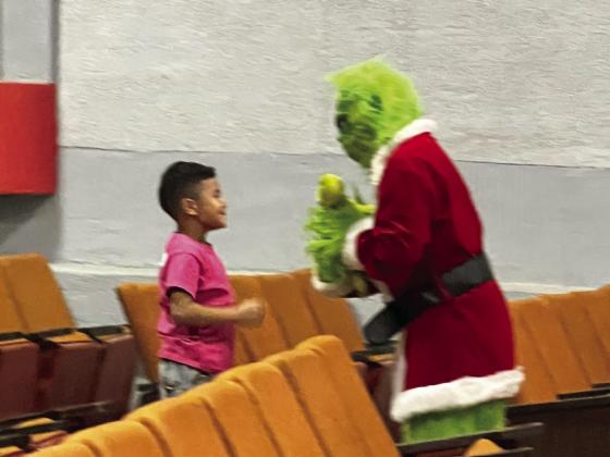 Santa and the Grinch visit Tulia Fire Department
