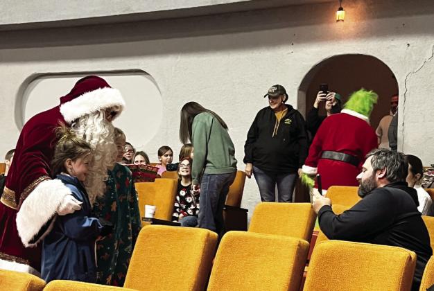 Santa and the Grinch visit Tulia Fire Department