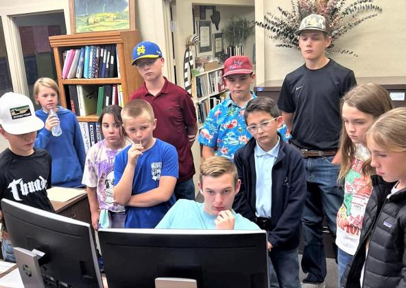 Castro County 4-H and Nazareth Robotics team member Spencer Acker assisted with programming at the robotics meeting on Tuesday night.