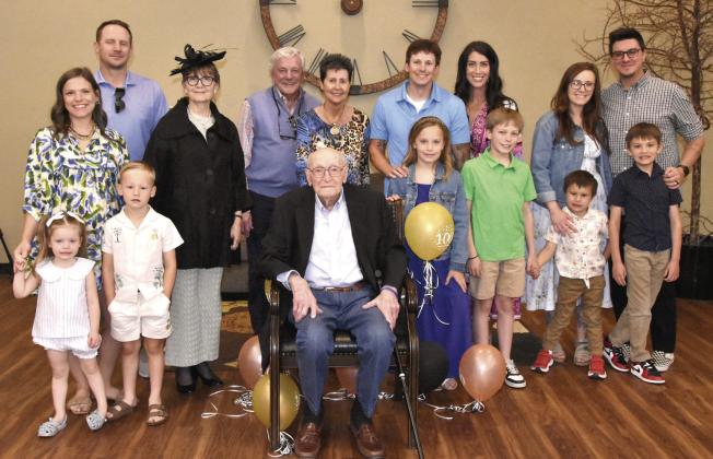 CENTENNIAL CELEBRATION--William Eugene “Bub” Sparks, seated center, marked his 100th birthday on Monday, May 4. A reception was held in his honor Sunday, May 3 in the Fellowship Hall of First Baptist Church with a huge crowd of family and friends in attendance. Here, Bub is shown gathered with members of the Sparks clan for a family photo to commemorate the occasion. (Photo by Jim Steiert)