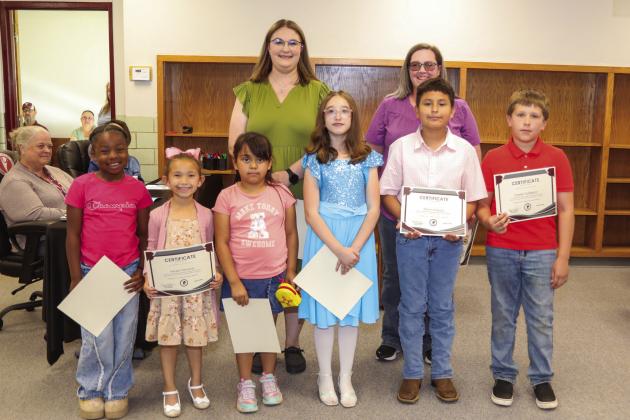 Tulia Elementary School Recognitions Back Row: Mikayla Adams, and Lori DeFries Front Row: London Session, Harper Pastrana, Alexa Bustos, Isadora Gatlin, Martin Delgado,