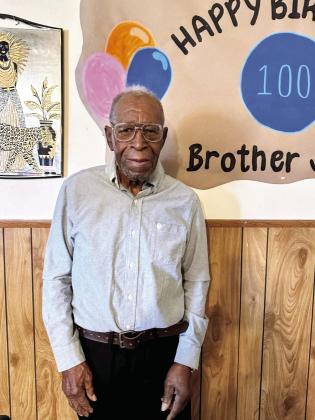 John Brookins with his family at his birthday party (below)