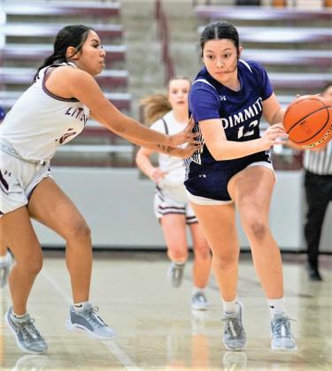 Bobbies Braylynn Chavira drives around a Littlefield defensive player. (Dimmitt Sports Media photo)