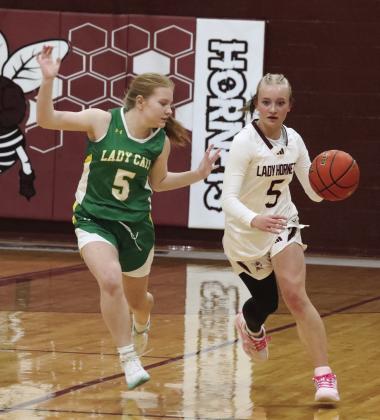 Sage Gore brings the ball down the court