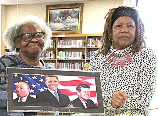 Library Display for February features Black History Month with Gwen Lewis, left, and Joyce Thomas exhibiting items relating to the Buffalo Soldiers.