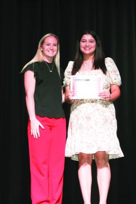 Mrs. Cameron Luedtke presented the Agricultural Award to Brianna Evans.