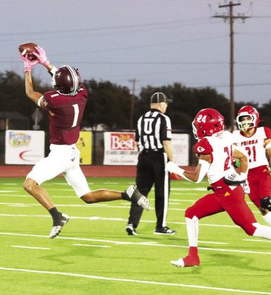 Tulia’s Logan Becerra catches the ball and runs it in for a touchdown