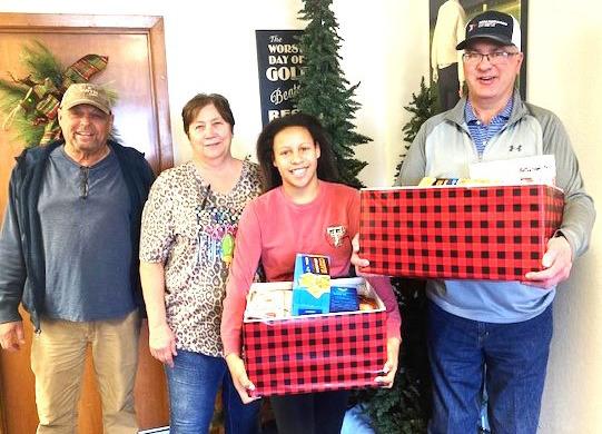Food boxes were collected at the Dimmitt Country Club to help needy families during the holiday.