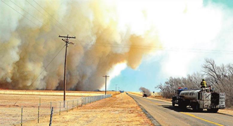 Firefighters battle fast-moving blazes