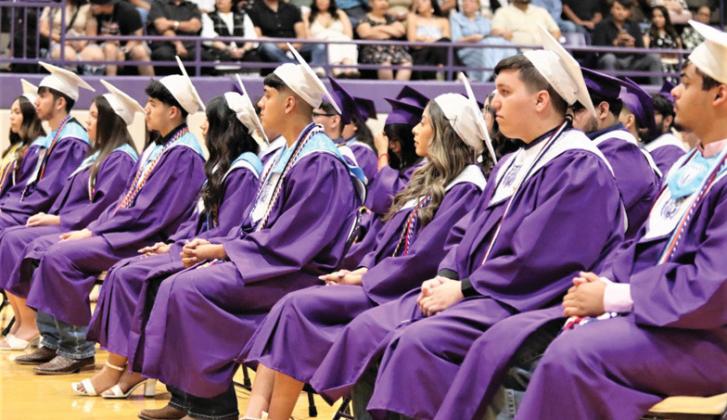 Dimmitt High School seniors, parents, family and friends attended the commencement ceremony for seniors who closed the door on high school to take a big step into the future (top photo). Many will be attending college, trade schools, joining the military or getting jobs as they continue their journey into adulthood. The DHS valedictorian was Veera Bhakta (bottom left) and the salutatorian was Isaura Guido (bottom right).