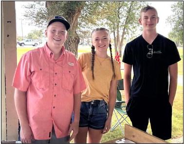 Texas 4-H STEM Ambassador Spencer Acker (right) from Castro County 4-H, along with Lynn County 4-H ambassadors Mason Scott and Annie Watson spent the day at the Swisher County Fair promoting and introducing robotics to young attendees.