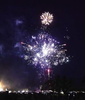 LIGHTING UP THE NIGHT--A spectacular fireworks display over Dameron Park in downtown Hereford wrapped up the 250th birthday celebration of America's Declaration of Independence on Saturday evening, July 4. People watched from the park, and from parking lots all over town. (Photos by Jim Steiert)