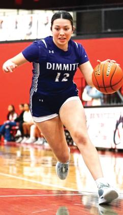 Bobbies Braylynn Chavira drives around a Lady Cub into the lane. (Dimmitt Sports Media photo)