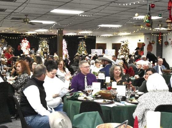 GLITZY SURROUNDINGS—Gala goers are surrounded by glitz at the Festival of Trees. (Photo by Jim Steiert)