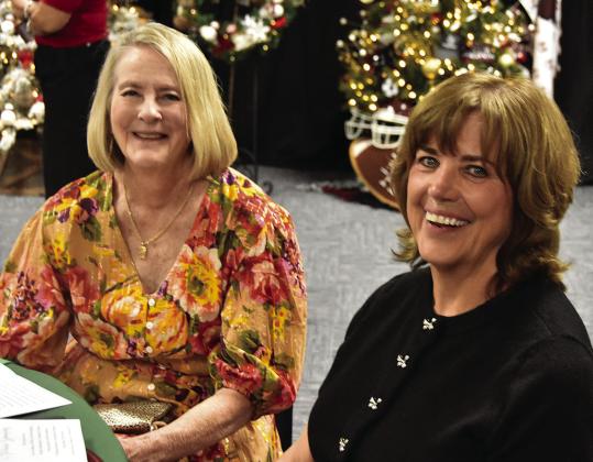 SANTA’S WATCHING— Cheryl Betzen and the ever- mischievous-looking Kay Brorman checking things out during the Festival of Trees Gala. (Photo by Jim Steiert