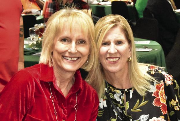 SILENT AUCTION ACES— Emily Knight and Sharon Lowry were busy working the mental game concerning the silent auction at the Festival of Trees Gala. (Photo by Jim Steiert)