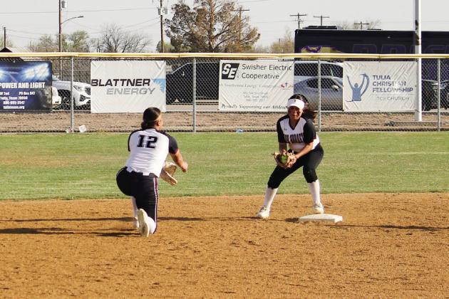 Kyla Rodriguez pitches the ball to Mariah Briones at 2nd base for an out