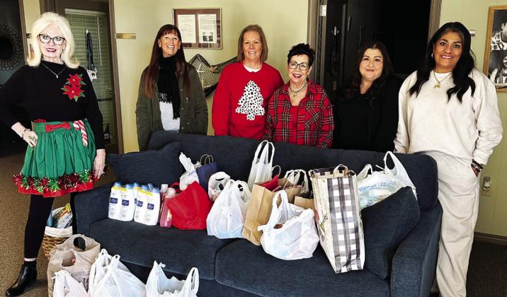 La Madre Mia members brought toiletry items with them to their Christmas party to donate to the Deaf Smith County Crisis Center which are much needed by those seeking the Crisis Center services. Several members of the club dropped those donated items off at the Crisis Center on Friday, December 5. Pictured left to right are La Madre Mia members Cindy Cassels, Cathy Bunch, Kristen Hicks, Tonja Horrell with Crisis Center employees Angela Gamboa and Mindy Salazar. Courtesy Photo