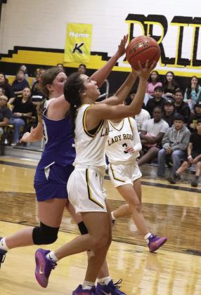 Hope McLain takes the ball to the basket Drue Searsy goes in for a layup