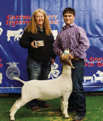 Mayson Simpson with his buckle for Junior Goat Showmanship.