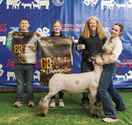 Rylee Scholz is pictured with her Grand Champion Lamb at this year's Castro County Junior Livestock Show.