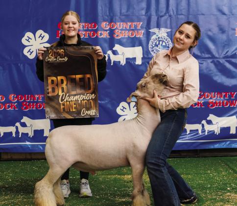 Rylee Scholz won Senior Lamb Showmanship and is pic- tured with her Breed Champion Finewool.