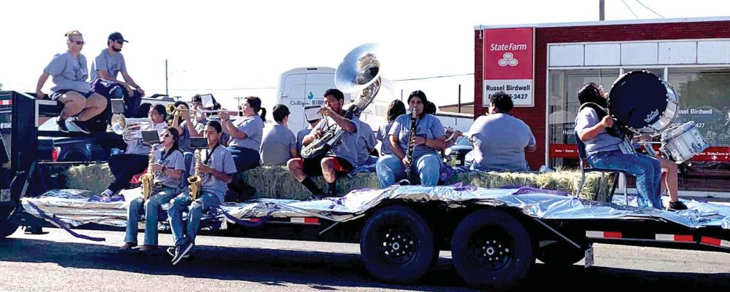 The Dimmitt High School Band played music from their float during the County Fair parade.