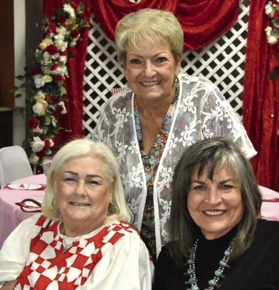 DERBY DAY LADIES--This trio of lovely ladies were obviously having fun picking the favorite ponies at the seventh annual Kentucky Derby doings at the Hereford Senior Citizens Center May 2. Pictured from left are Terry Robison, Charlene Sanders, and Elaine Gerber.